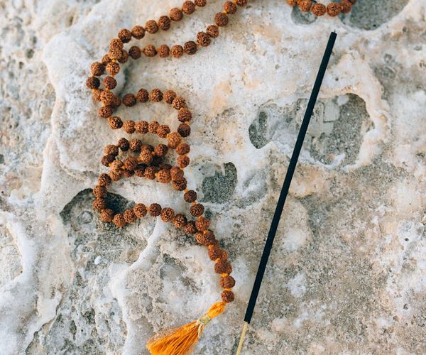 Balanced stones on a background of a calm sea at sunset.
